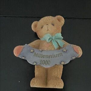 Charming Teddy Bear Figurine with Blue Bow